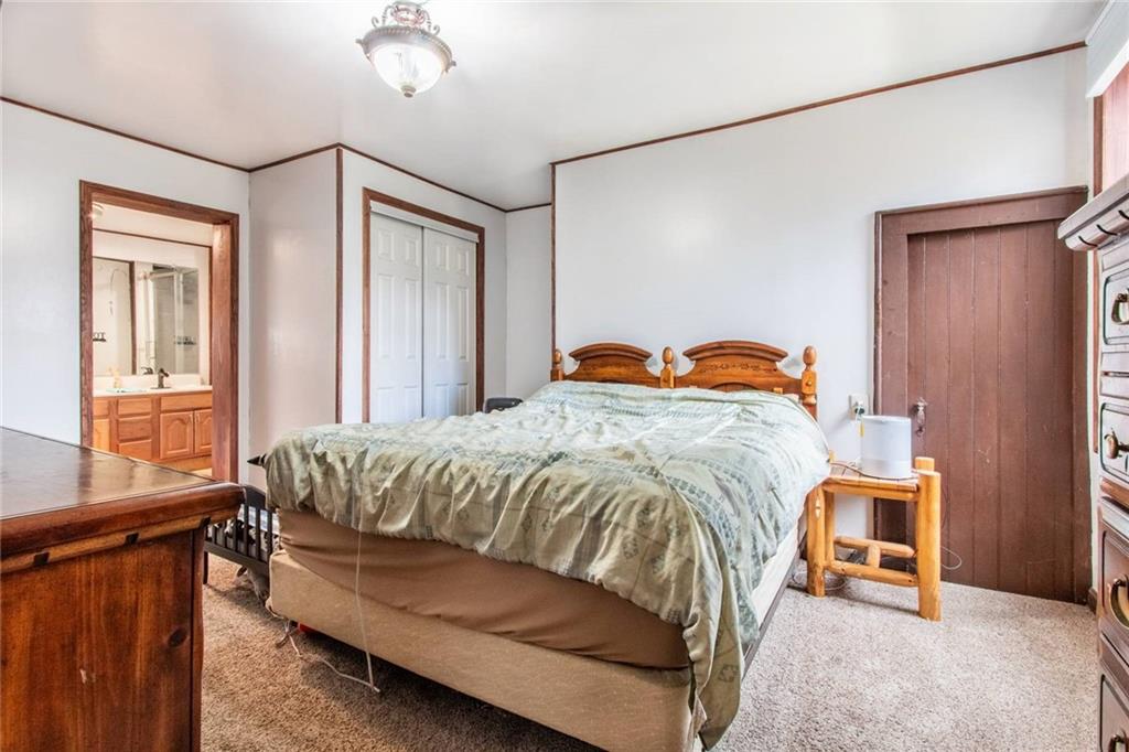 437 Petrolia Road Chicora, PA 16025 - Photo 10 of 29 a bedroom with a bed and a window