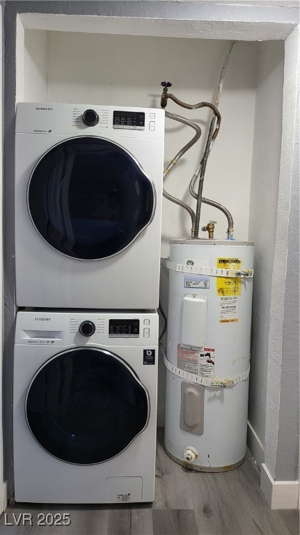 3240 Michael Way, Unit 3 Las Vegas, NV 89108 - Photo 19 of 22 Laundry room with stacked washer and clothes dryer, water heater, and wood finished floors