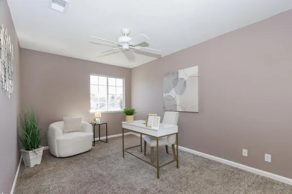 a living room with furniture and a window