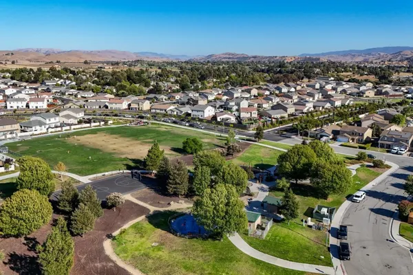 an aerial view of a houses with a lake view