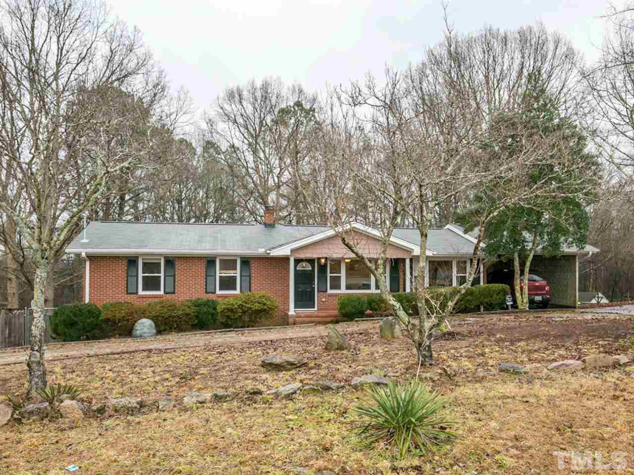 3628 Edgemont Road Wendell, NC 27591 - Photo 1 of 17 a front view of a house with a garden