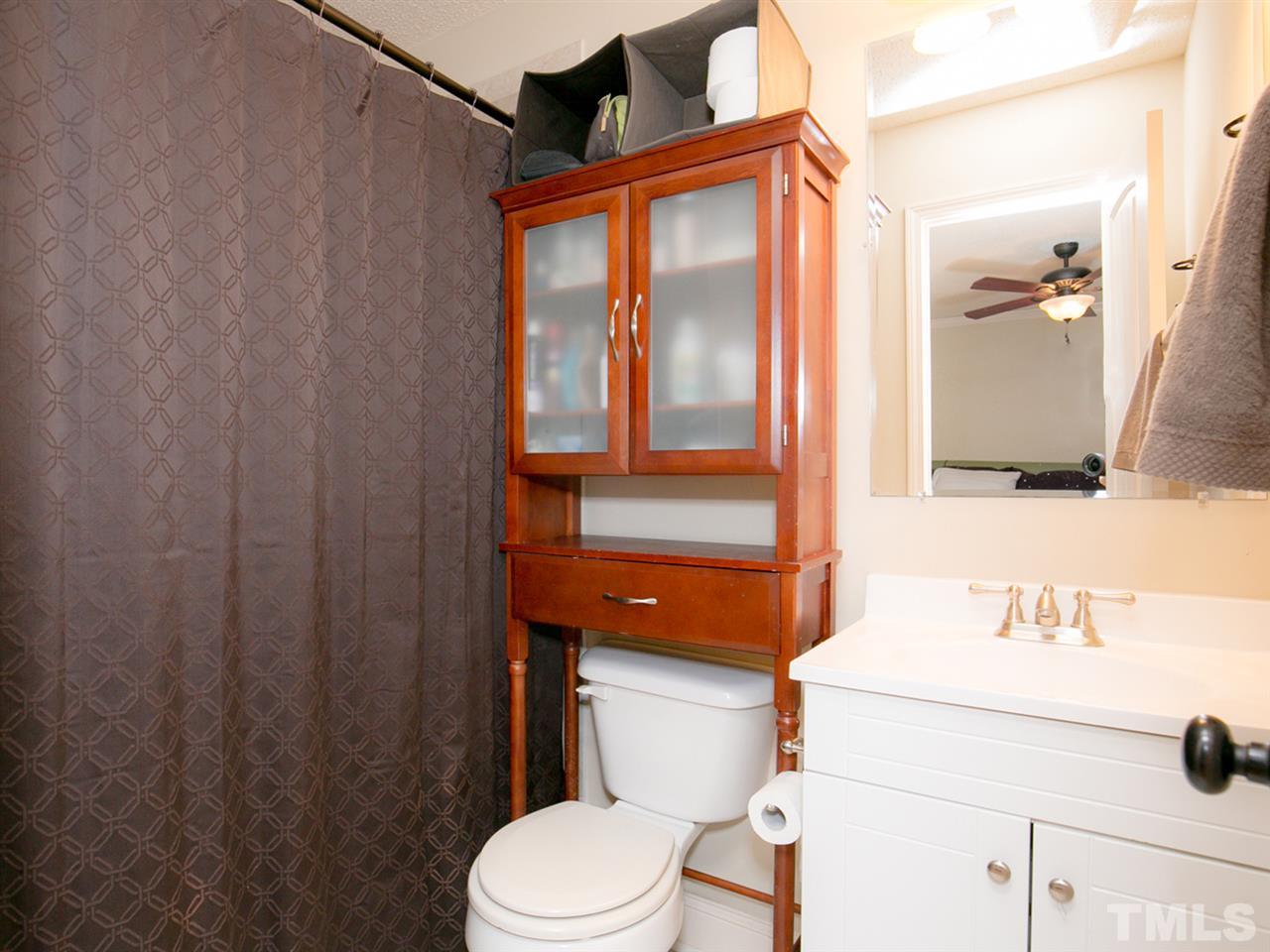 3628 Edgemont Road Wendell, NC 27591 - Photo 13 of 17 a bathroom with a sink a toilet and shower