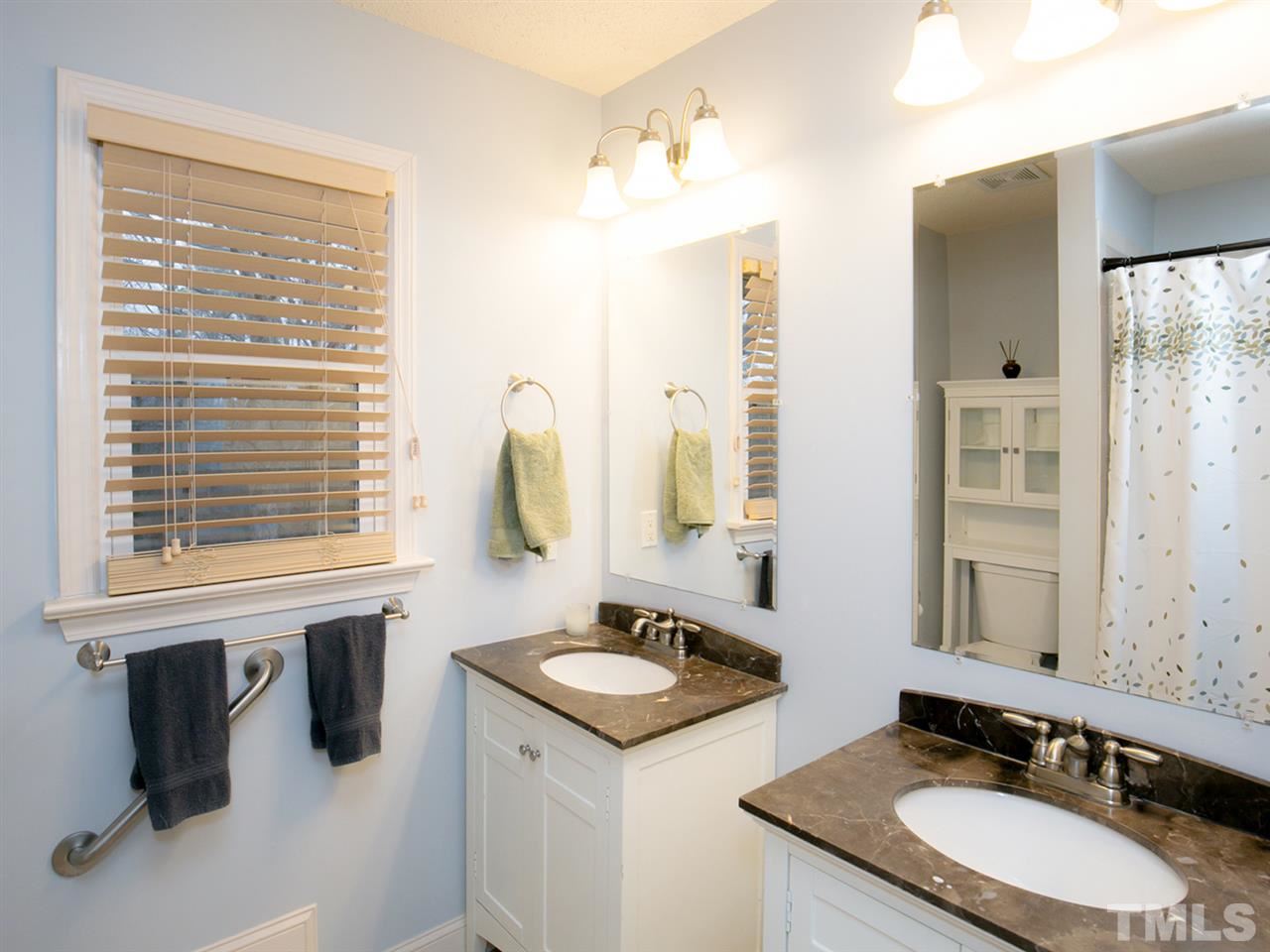 3628 Edgemont Road Wendell, NC 27591 - Photo 14 of 17 a bathroom with a granite countertop sink and a mirror
