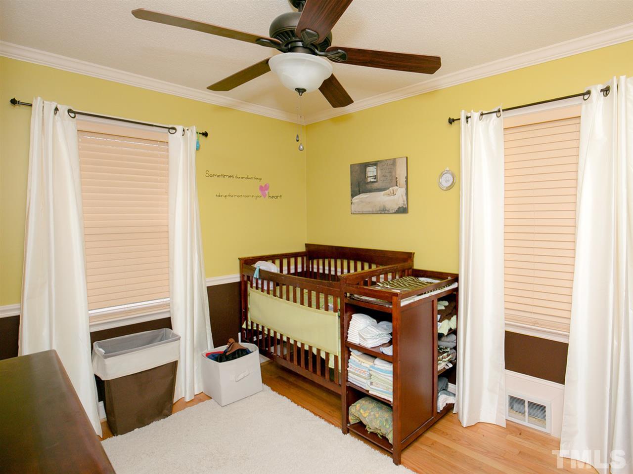 3628 Edgemont Road Wendell, NC 27591 - Photo 15 of 17 a bedroom with a bed and a window