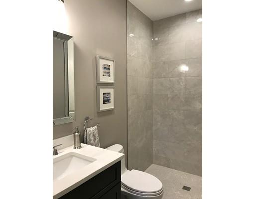 112 Osborne Path Newton, MA 02459 - Photo 3 of 29 a bathroom with a sink a toilet and shower