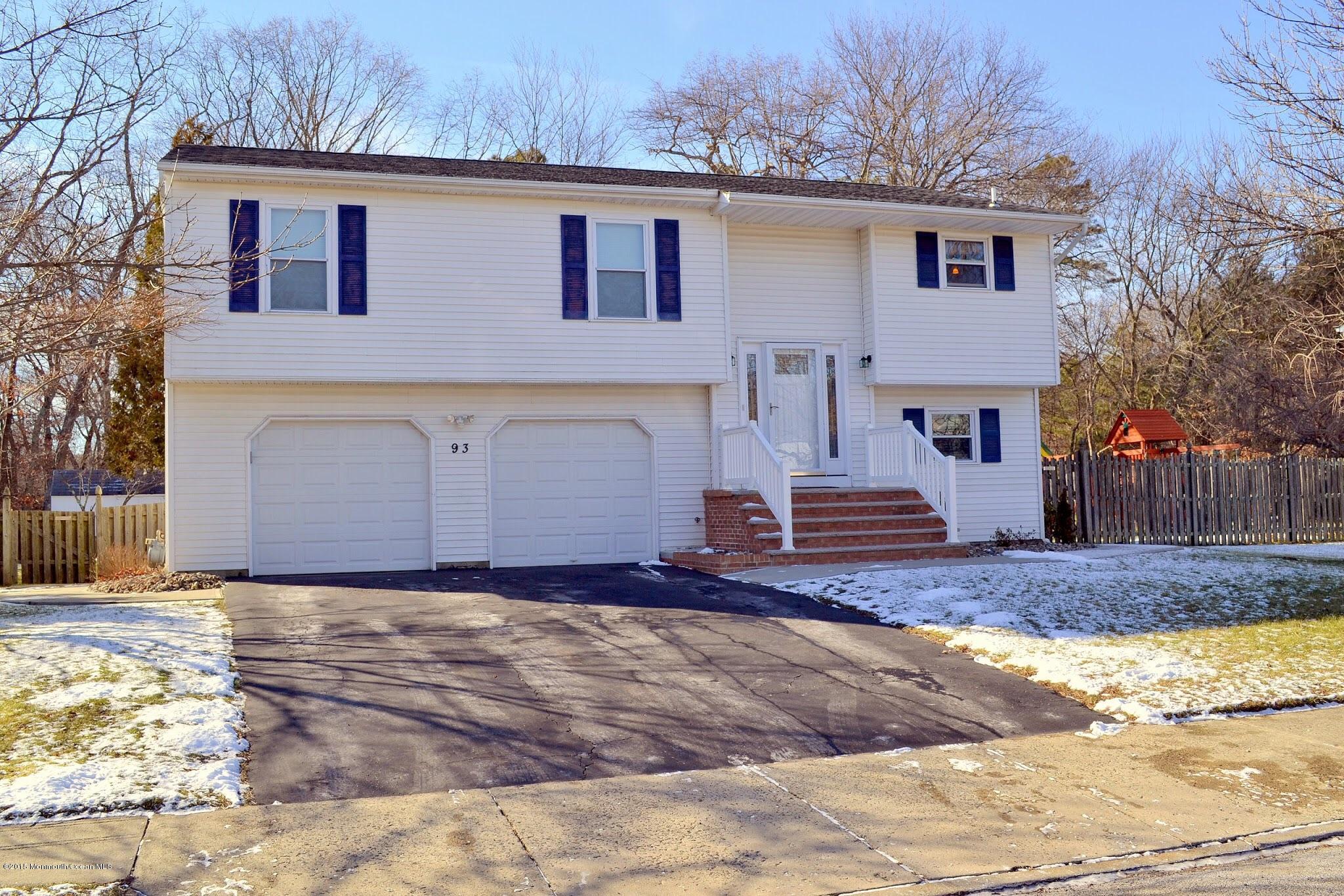 93 Starlight Road Howell, NJ 07731 - Photo 1 of 28 a front view of a house with a yard