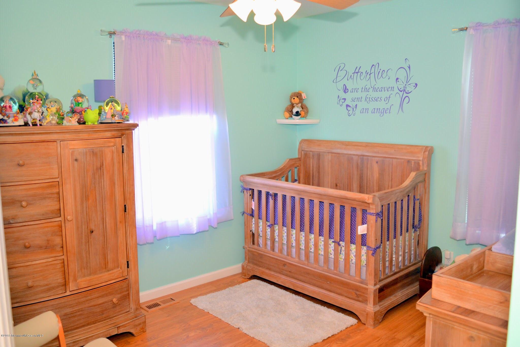 93 Starlight Road Howell, NJ 07731 - Photo 11 of 28 a bedroom with a bed and a window