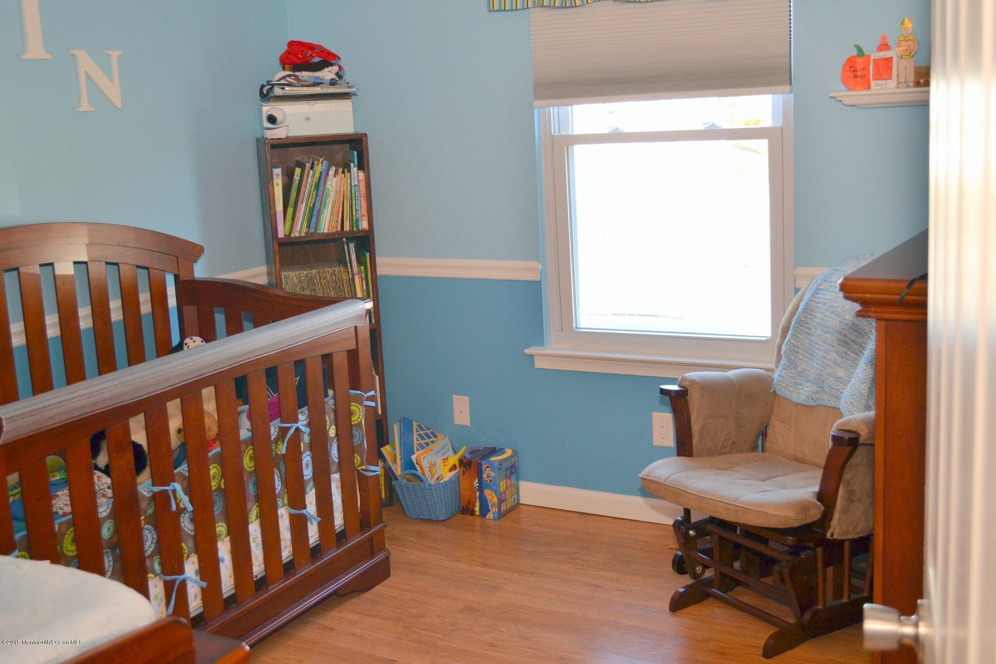 93 Starlight Road Howell, NJ 07731 - Photo 12 of 28 a bedroom with furniture and a window