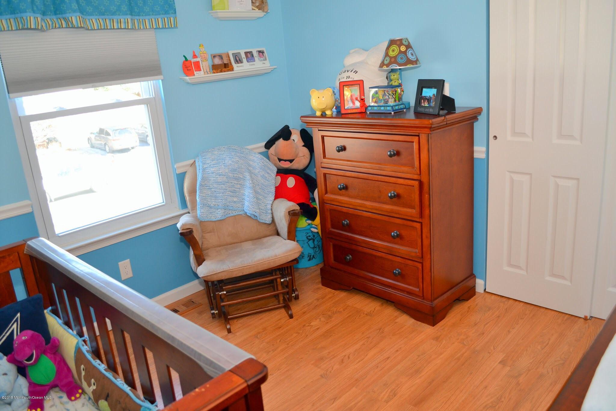 93 Starlight Road Howell, NJ 07731 - Photo 13 of 28 a room with toys and dresser with wooden floor