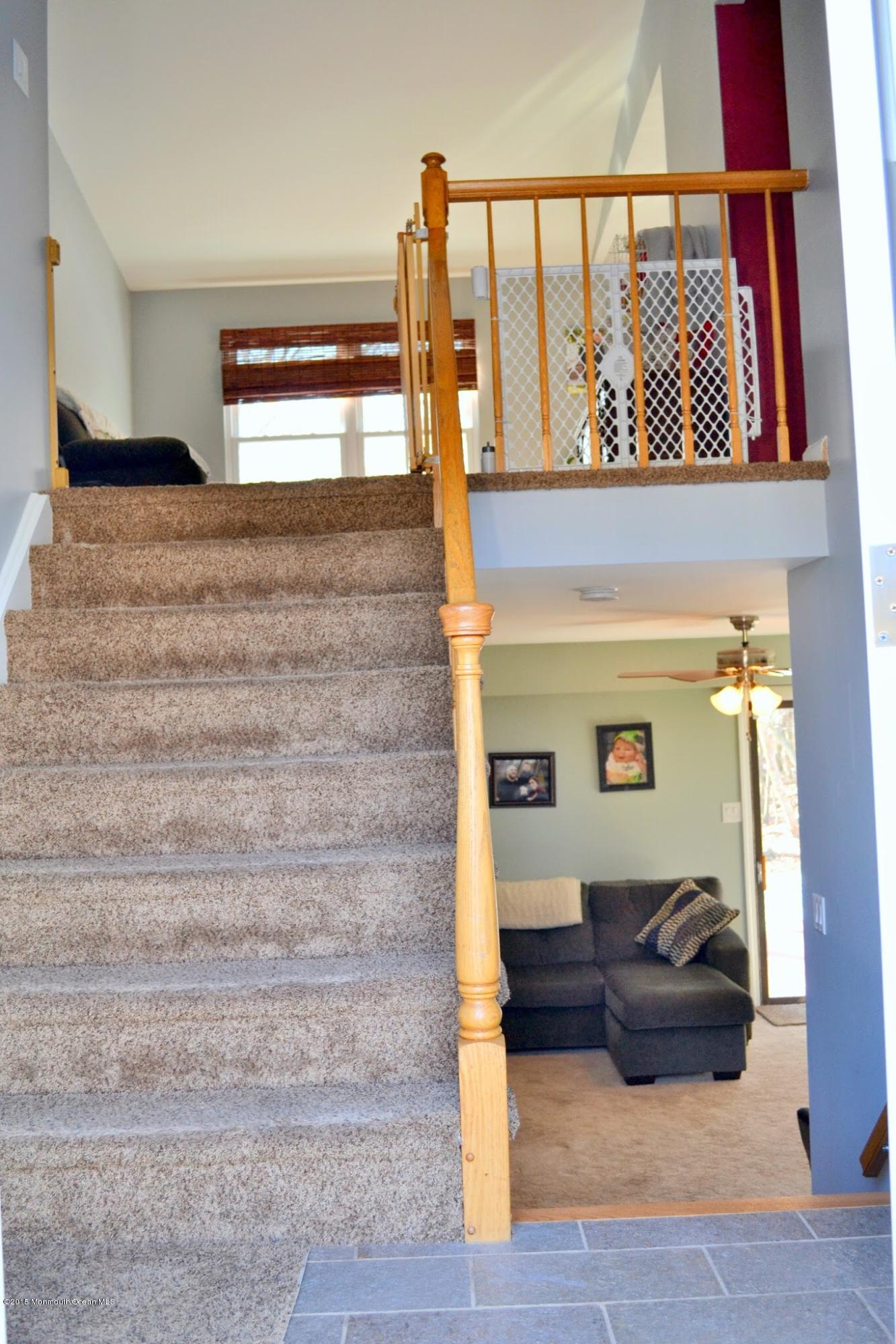 93 Starlight Road Howell, NJ 07731 - Photo 19 of 28 a view of entryway and hall with wooden floor