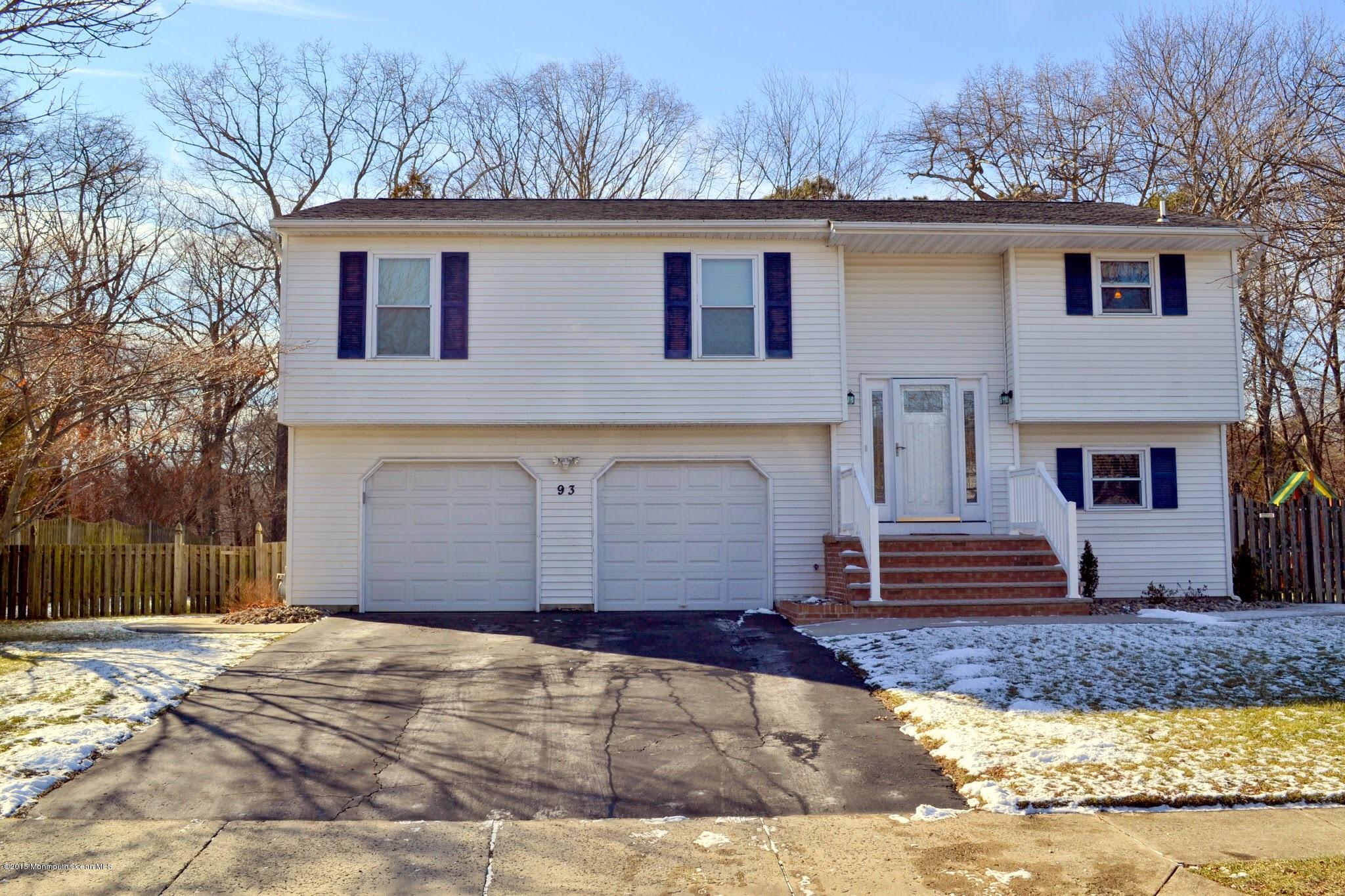 93 Starlight Road Howell, NJ 07731 - Photo 2 of 28 a front view of a house with a yard