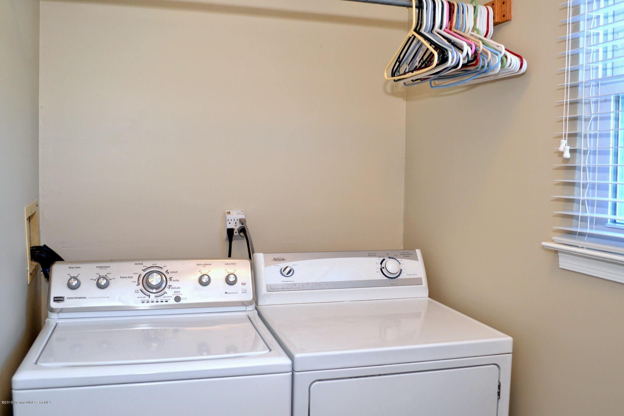 93 Starlight Road Howell, NJ 07731 - Photo 27 of 28 a utility room with dryer and washer