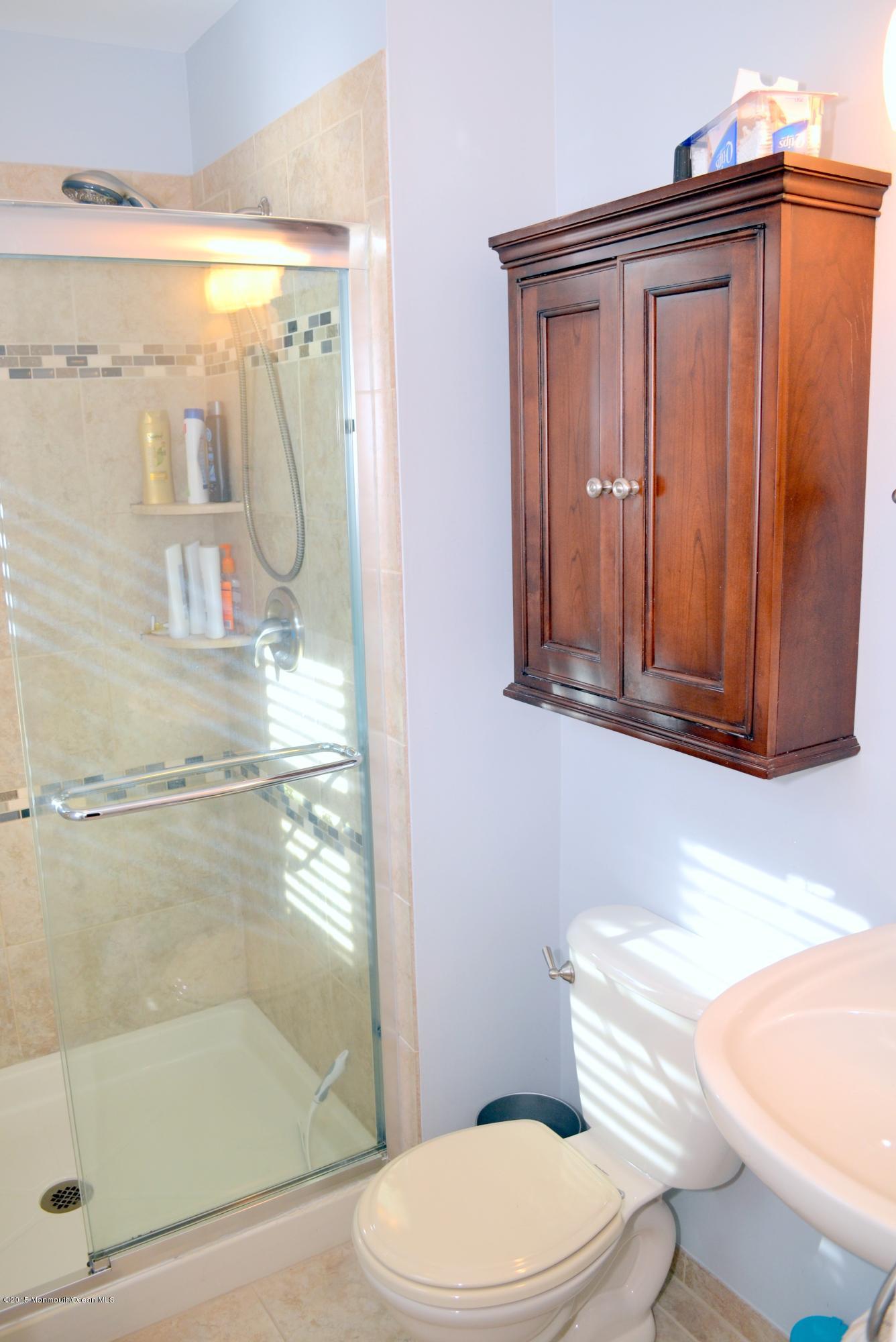 93 Starlight Road Howell, NJ 07731 - Photo 8 of 28 a bathroom with a shower a toilet and a sink