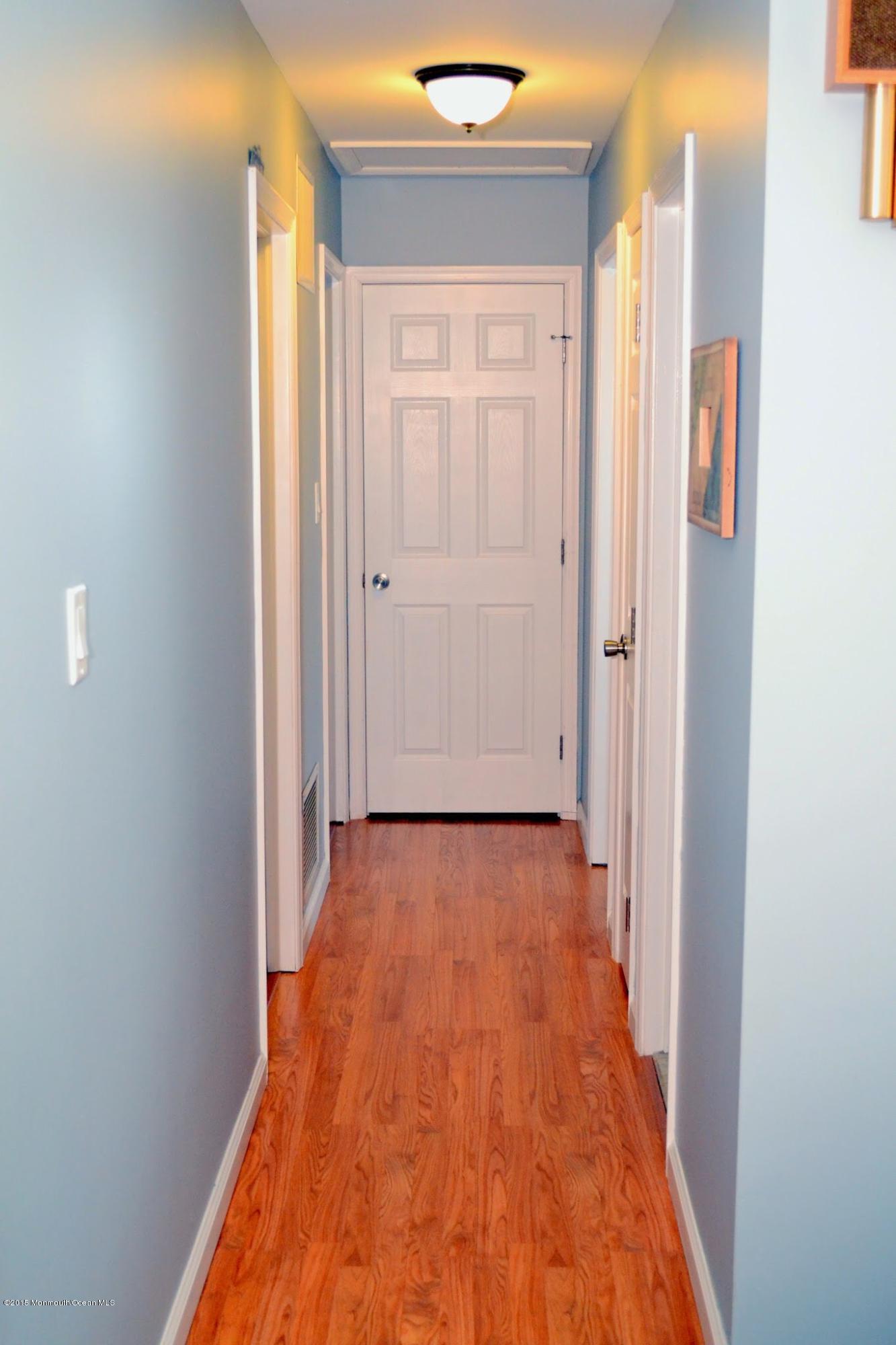 93 Starlight Road Howell, NJ 07731 - Photo 9 of 28 a view of a hallway with wooden floor