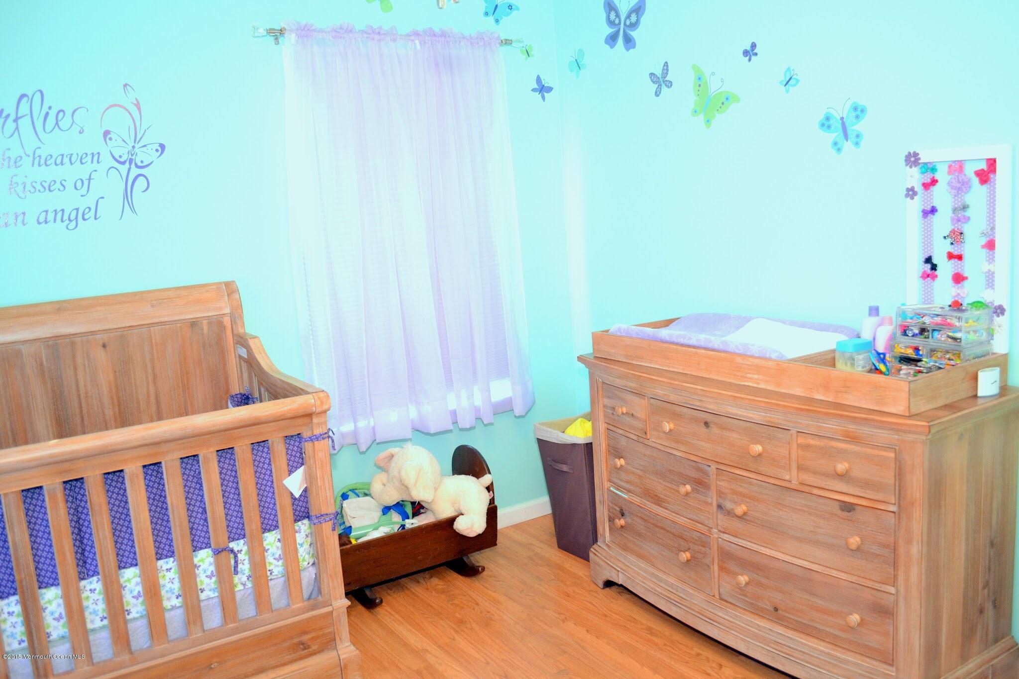 93 Starlight Road Howell, NJ 07731 - Photo 10 of 28 a bedroom with a bed and furniture