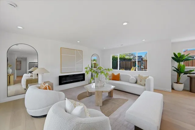 a front view of a house with a yard and swimming pool