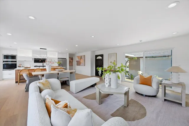 a view of patio with a table and chairs under an umbrella
