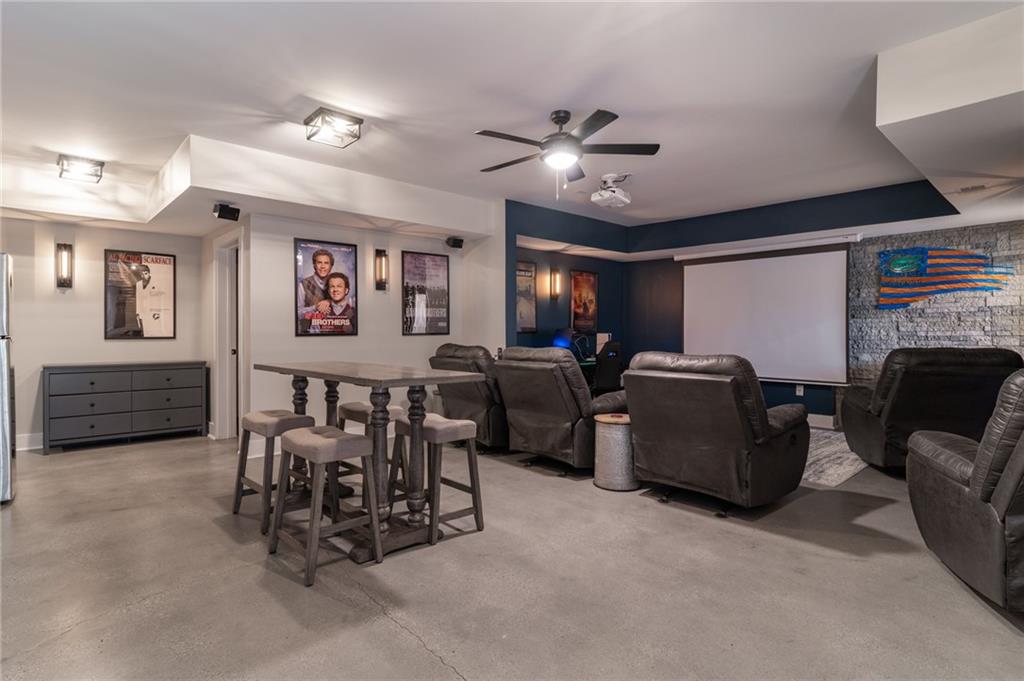 2250 Sperin Road Ball Ground, GA 30107 - Photo 30 of 56 a view of a livingroom with furniture and a flat screen tv