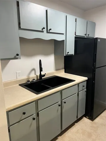 a kitchen with cabinets and sink
