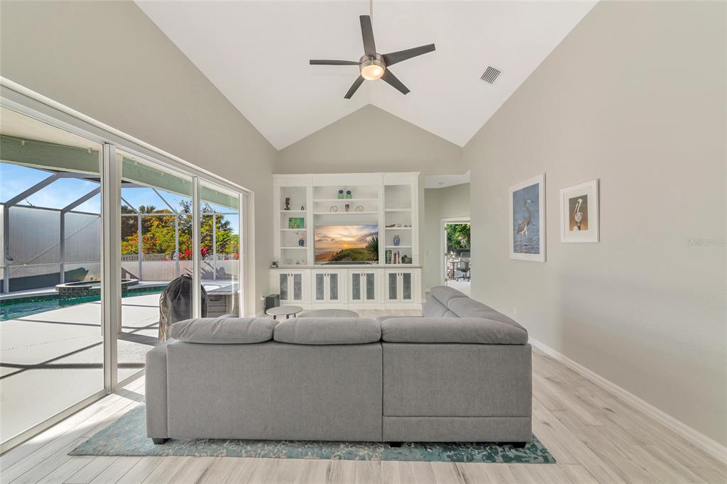 1019 Scherer Way Osprey, FL 34229 - Photo 14 of 56 a living room with furniture and a window