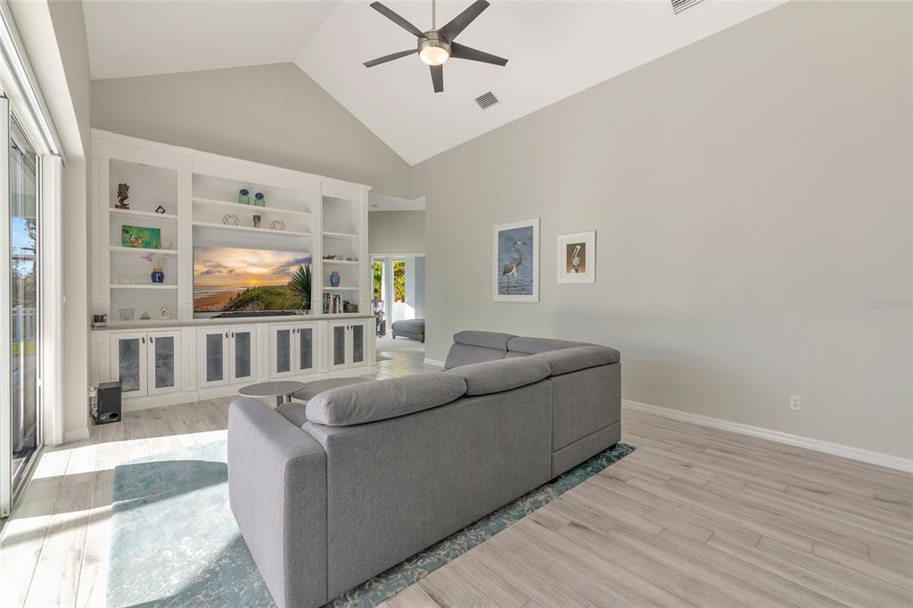 1019 Scherer Way Osprey, FL 34229 - Photo 15 of 56 a living room with furniture and windows