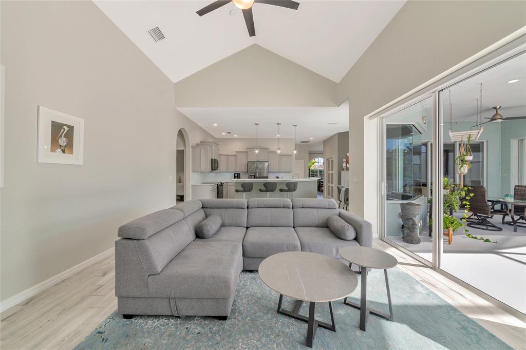 1019 Scherer Way Osprey, FL 34229 - Photo 16 of 56 a living room with furniture and a table