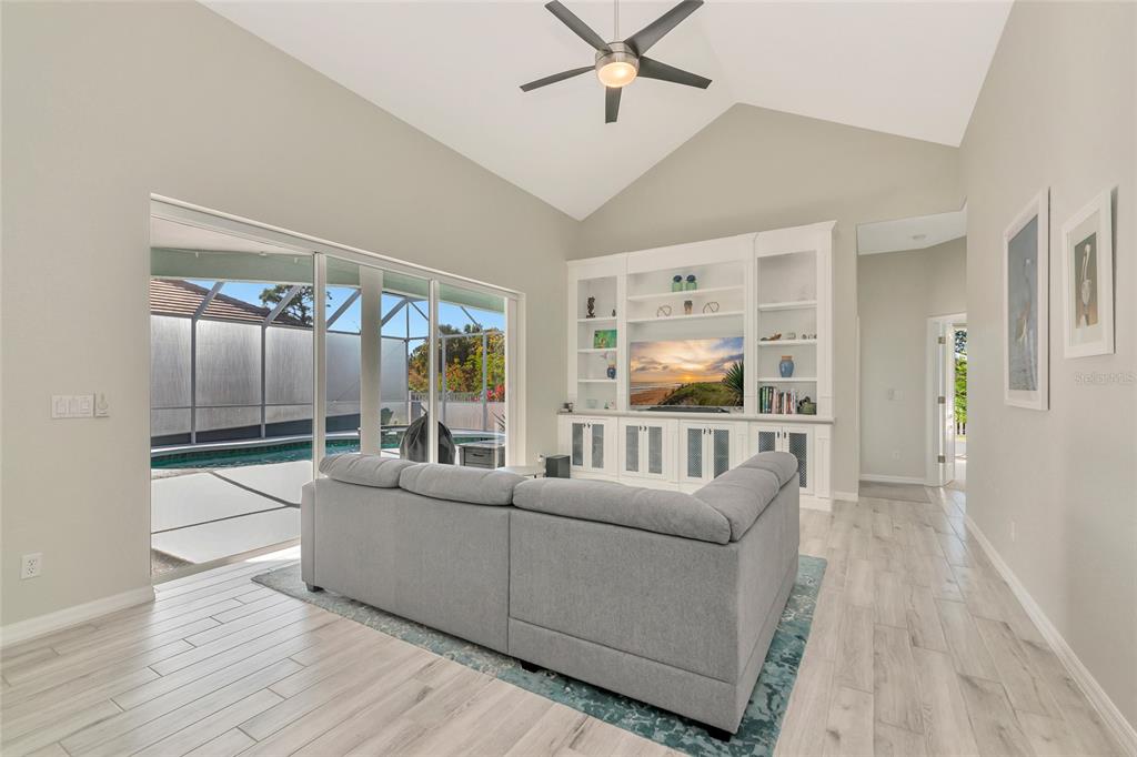 1019 Scherer Way Osprey, FL 34229 - Photo 17 of 56 a living room with furniture and a large window
