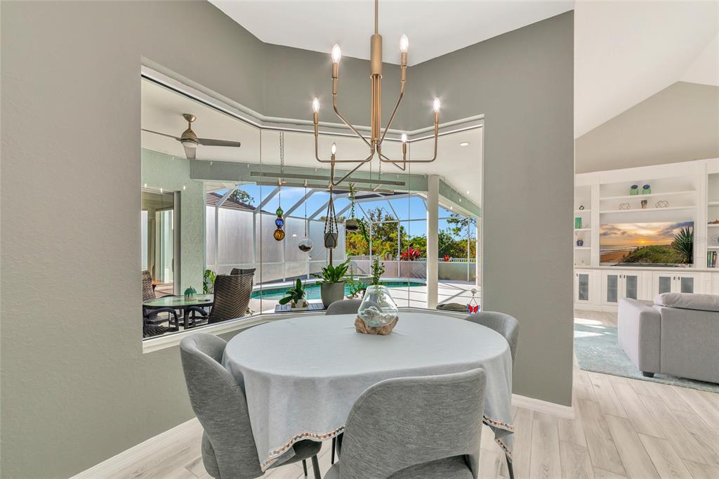 1019 Scherer Way Osprey, FL 34229 - Photo 19 of 56 a view of a dining room with furniture and chandelier