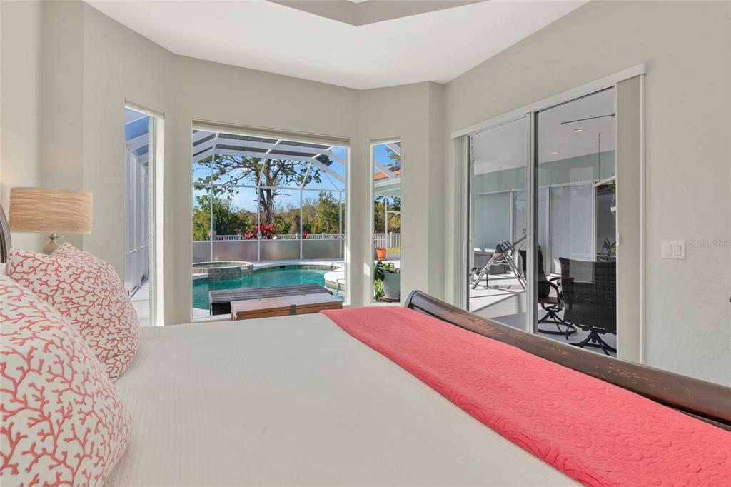 1019 Scherer Way Osprey, FL 34229 - Photo 28 of 56 a bedroom with a bed and large window