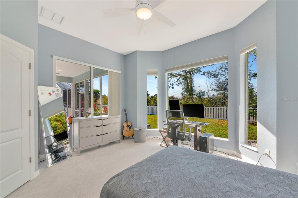 1019 Scherer Way Osprey, FL 34229 - Photo 32 of 56 a bed room with furniture and a large window