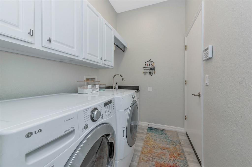 1019 Scherer Way Osprey, FL 34229 - Photo 35 of 56 a utility room with dryer and washer