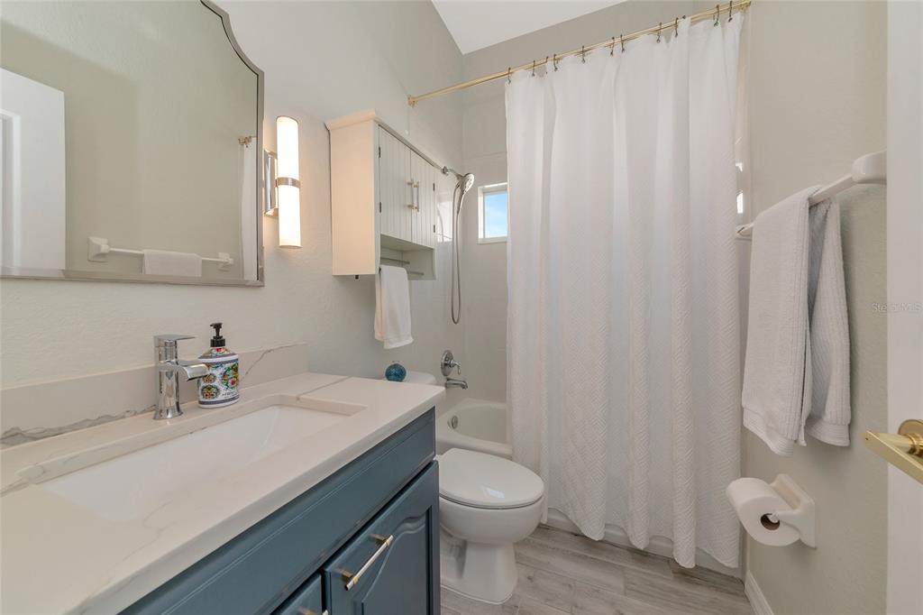 1019 Scherer Way Osprey, FL 34229 - Photo 36 of 56 a bathroom with a sink a toilet and shower