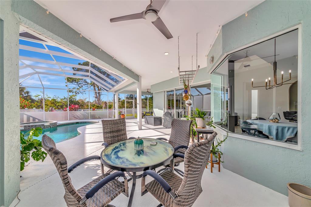 1019 Scherer Way Osprey, FL 34229 - Photo 39 of 56 a view of a dining room with furniture window and outdoor view
