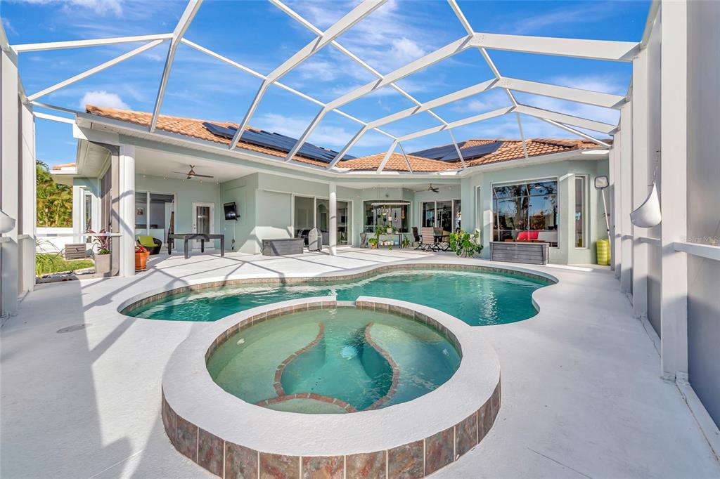 1019 Scherer Way Osprey, FL 34229 - Photo 40 of 56 a swimming pool with outdoor seating and yard