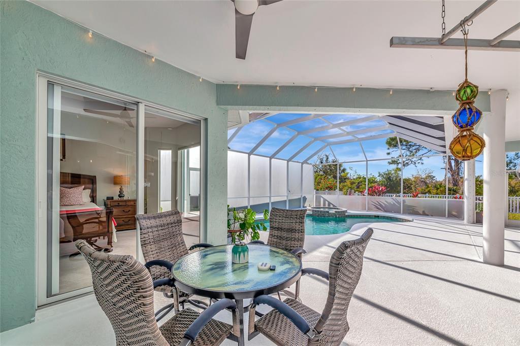 1019 Scherer Way Osprey, FL 34229 - Photo 41 of 56 a dining room with a table and chairs