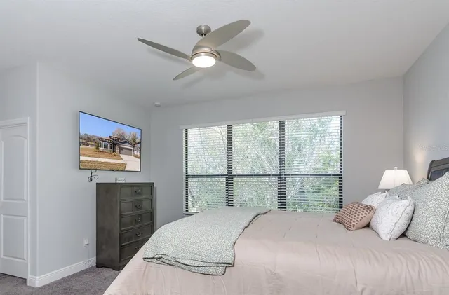 a bedroom with a bed and a dresser