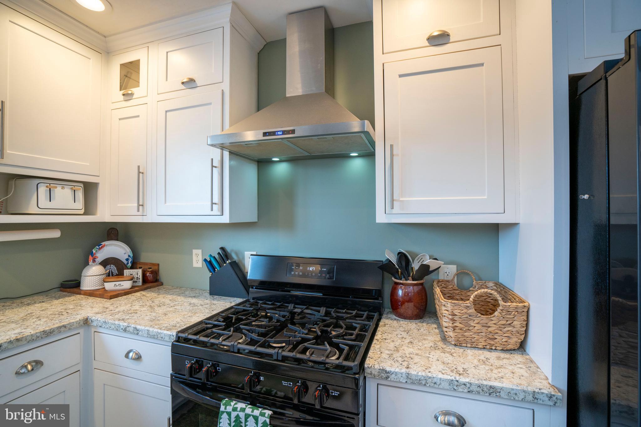 156 East Main Street Howard, PA 16841 - Photo 22 of 84 a kitchen with stainless steel appliances granite countertop a stove and a refrigerator