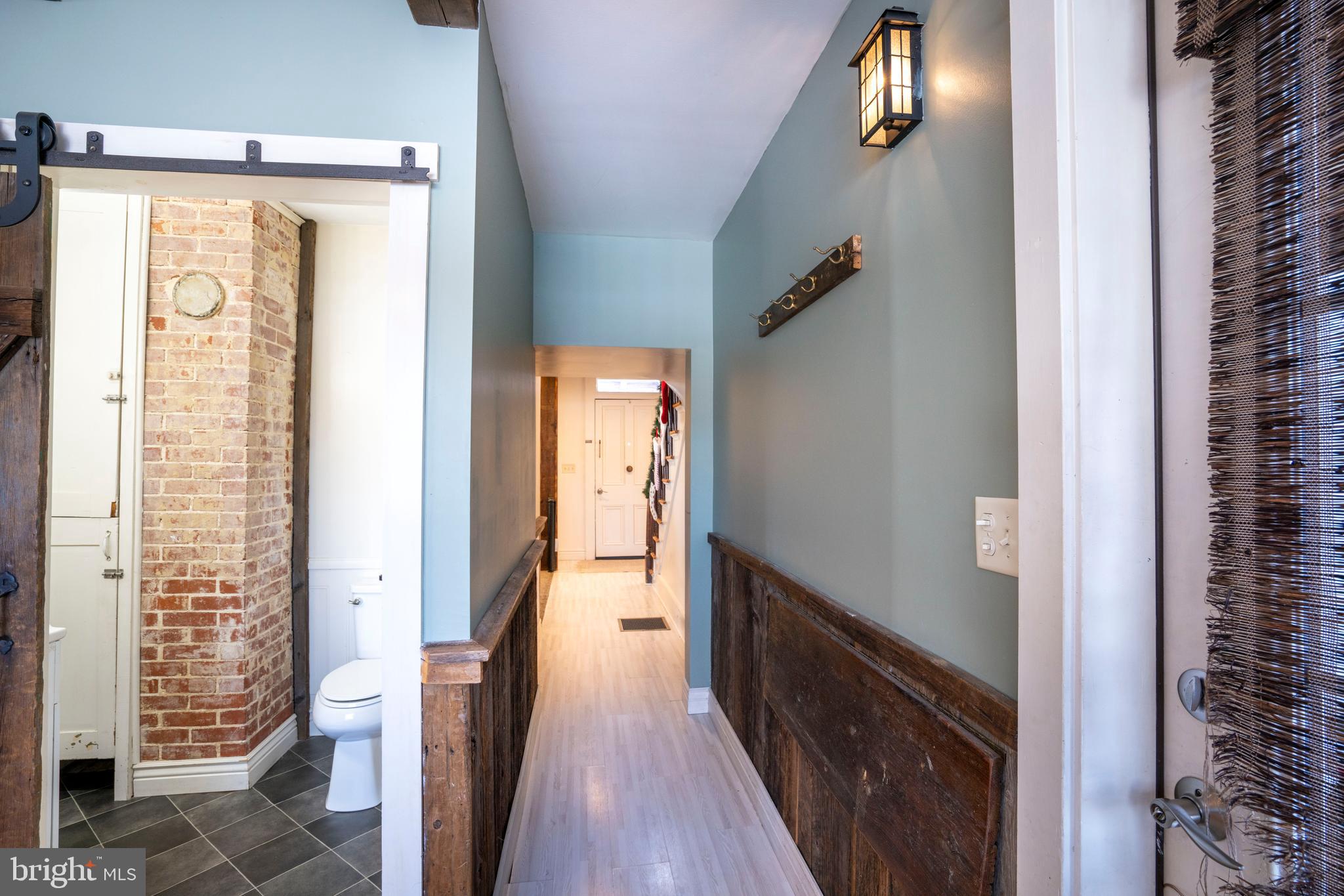 156 East Main Street Howard, PA 16841 - Photo 32 of 84 a view of a hallway with wooden floor and staircase