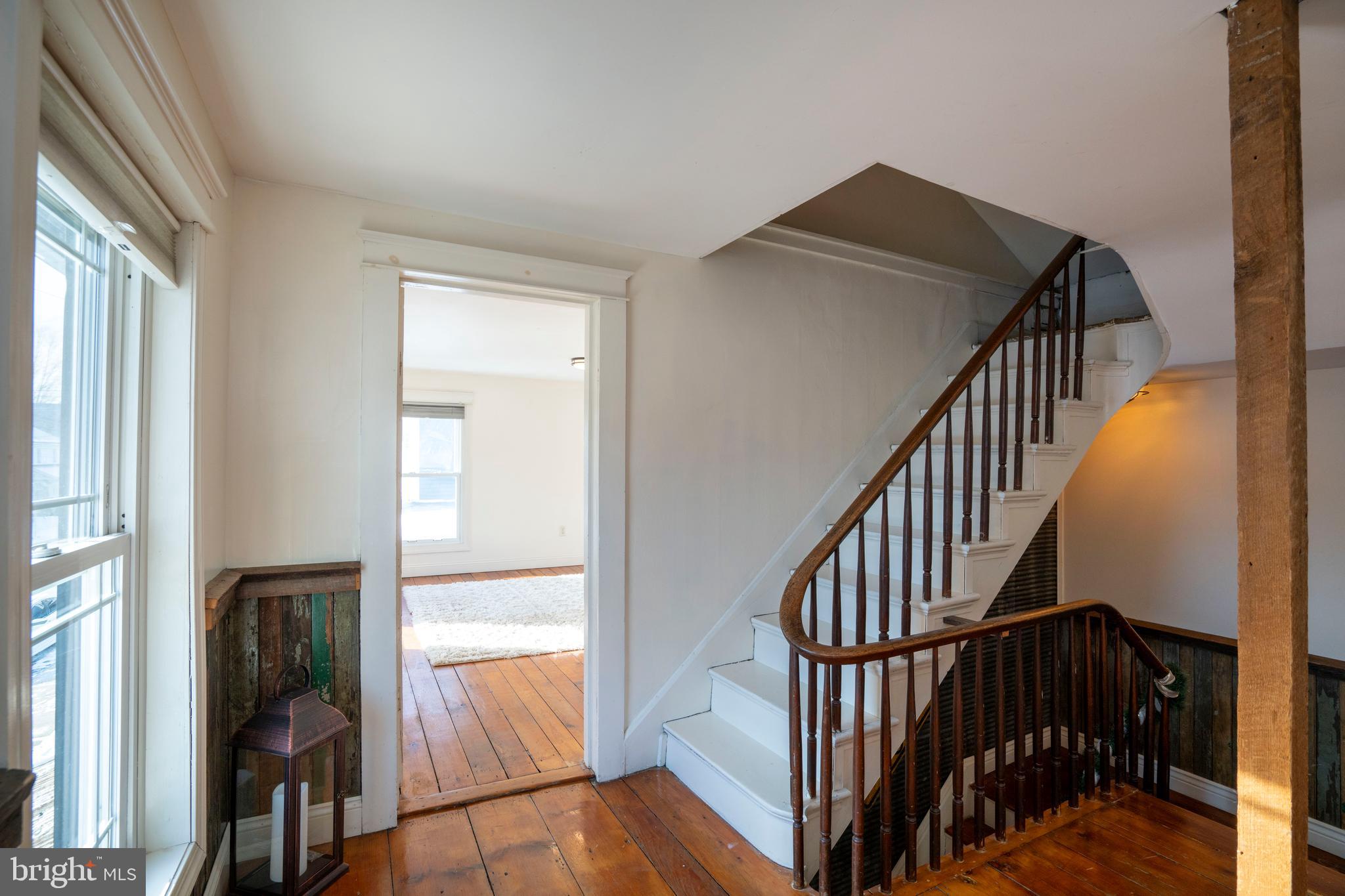 156 East Main Street Howard, PA 16841 - Photo 46 of 84 a view of staircase with wooden floor and white walls