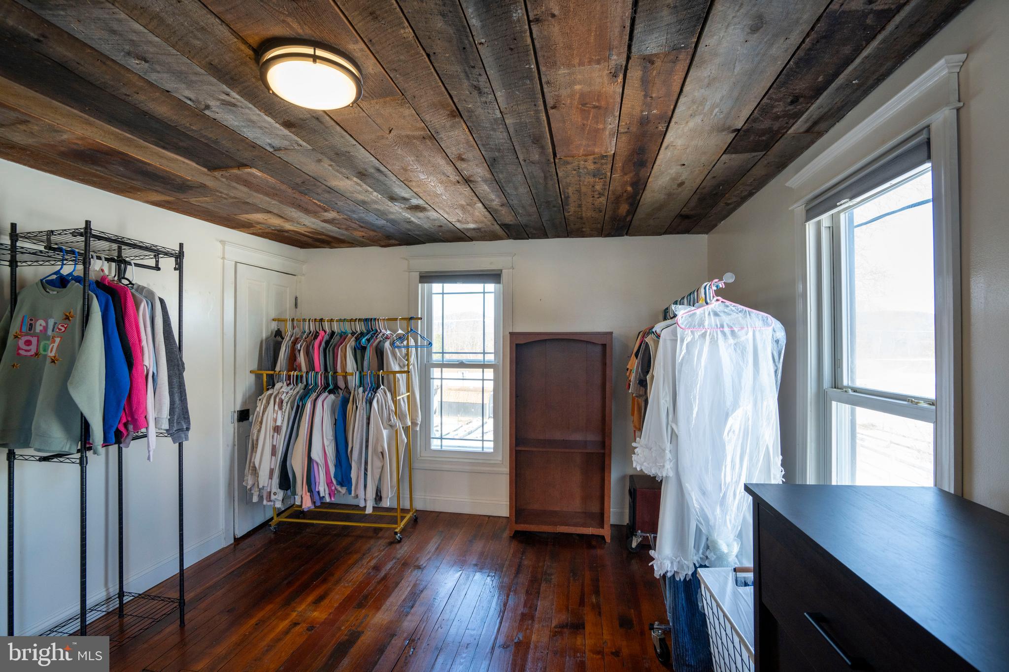 156 East Main Street Howard, PA 16841 - Photo 55 of 84 a view of a hallway with wooden floors and a large window