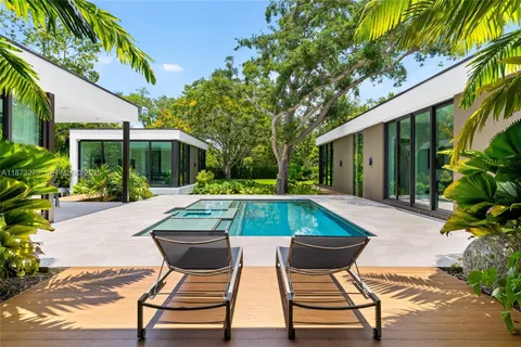 a view of a swimming pool with a lounge chairs