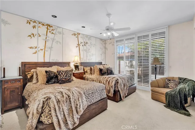 a bedroom with bed couch and window