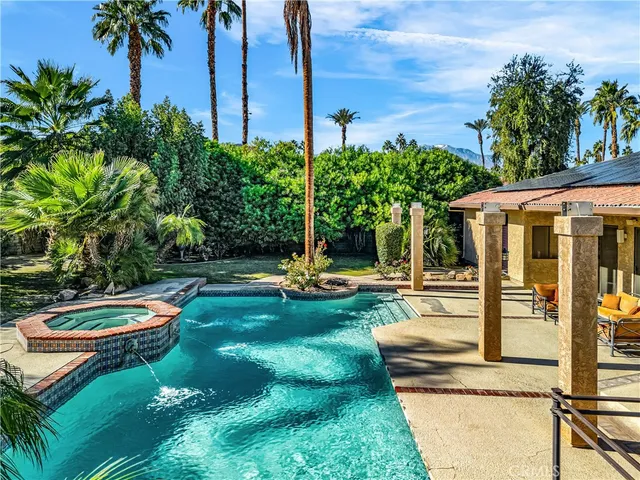 a view of a swimming pool with a patio