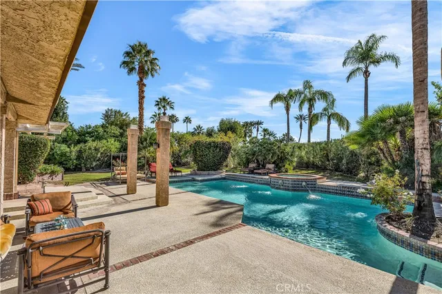 a view of a backyard with a garden and plants