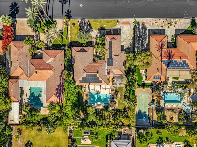 an aerial view of houses with yard