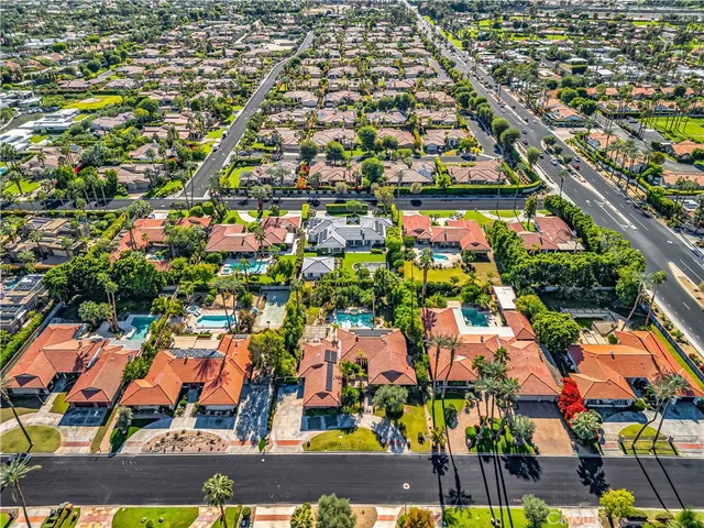 an aerial view of residential building and car parked