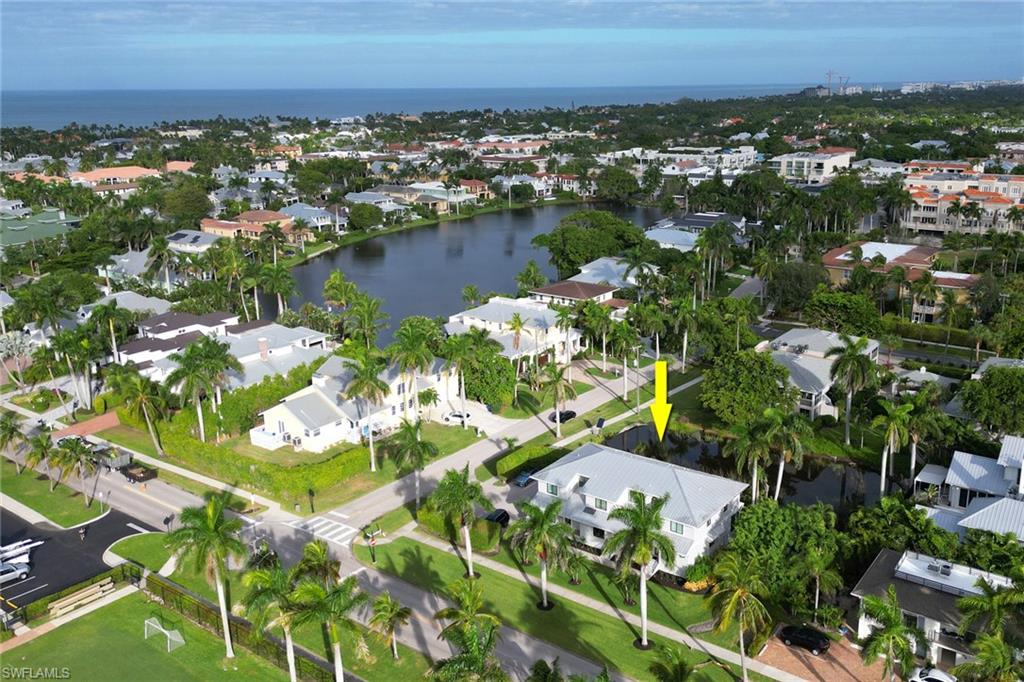 View of property location with a nearby body of water and nearby suburban area