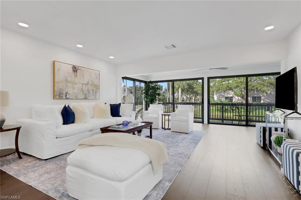 605 8th Avenue South, Unit 605 Naples, FL 34102 - Photo 14 of 50 Living area featuring hardwood / wood-style floors and recessed lighting