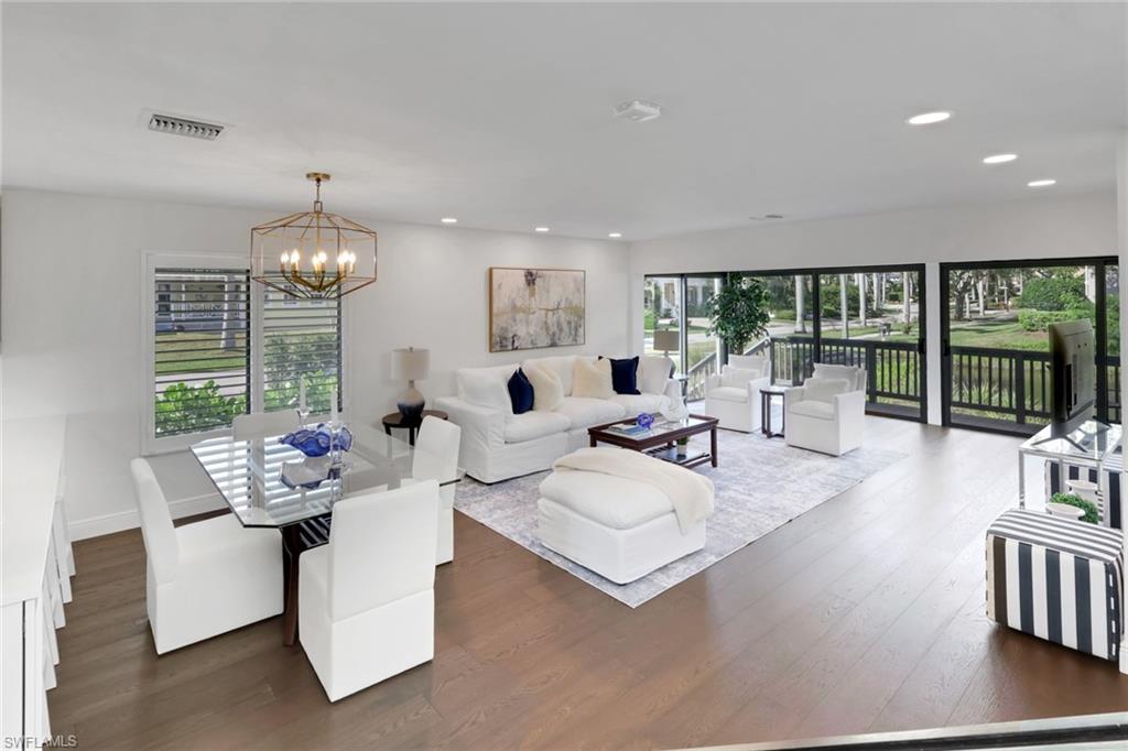 605 8th Avenue South, Unit 605 Naples, FL 34102 - Photo 18 of 50 Living area with dark wood finished floors, a chandelier, and recessed lighting