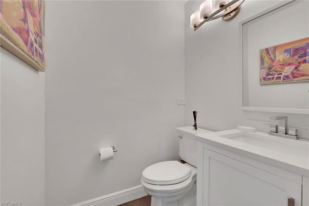 605 8th Avenue South, Unit 605 Naples, FL 34102 - Photo 21 of 50 Bathroom featuring vanity and dark wood-style flooring
